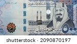 Small photo of Large fragment of the obverse side of 500 five hundred Saudi riyals banknote features Kaaba in Mecca and portrait of king AbdelAziz Al Saud series 1438 AH, Selective focus of Saudi Arabia currency