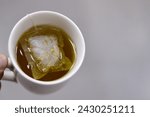 Small photo of Anise hot drink, with so many healthy benefits, anise packet in a boiled hot water to prepare the drink, Aniseed Pimpinella anisum is a flowering plant in the family Apiaceae, selective focus