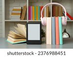 E book reader on table against...