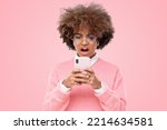 Small photo of Portrait of african girl cringe and looking at phone screen with disgust, reading something disgusting, bad joke or inappropriate content