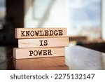 Wooden blocks with words 'Knowledge is power'.