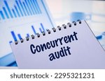 Small photo of Notepads with the inscription Concurrent audit. Business concept
