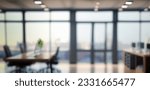 Small photo of Beautiful blurred background of a light modern office interior with panoramic windows and beautiful lighting.