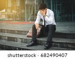 People unemployed businessman stress sitting on stair, concept of business failure and unemployment problem.
