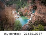 Small photo of Cascade of blue and crystalline waters called Chorreras del Cabriel, declared a natural monument in the province of Cuenca, Castilla la Mancha, Spain
