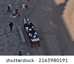Small photo of Vienna, Austria - 03-19-2022: Aerial view of a fiacre, a horse-drawn four-wheeled carriage, at square Stephansplatz in Vienna, Austria waiting for tourists.