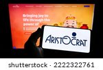 Small photo of Stuttgart, Germany - 10-03-2022: Person holding smartphone with logo of gambling company Aristocrat Leisure Limited on screen in front of website. Focus on phone display. Unmodified photo.