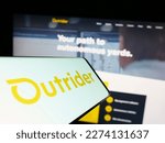 Small photo of Stuttgart, Germany - 03-07-2023: Smartphone with logo of American company Outrider Technologies Inc. on screen in front of website. Focus on center-right of phone display. Unmodified photo.