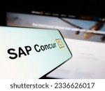 Small photo of Stuttgart, Germany - 07-11-2023: Mobile phone with logo of expense management software SAP Concur on screen in front of business website. Focus on left of phone display. Unmodified photo.