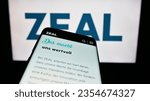 Small photo of Stuttgart, Germany - 08-24-2023: Mobile phone with website of German lottery company ZEAL Network SE on screen in front of business logo. Focus on top-left of phone display. Unmodified photo.