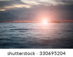 Small photo of Beautiful calm evening seascape with yacht sailing in dark blue seaways under bare poles floating in the sea in rays of amazing red sunset on horizon against red and blue cloudy sky, horizontal photo