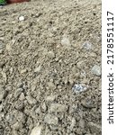 Small photo of Texture of crusher run. Crusher run is a blended mix of coarse aggregate and fine aggregate. The combination of both crushed stone and stone dust creates a low void content. Selective focus.
