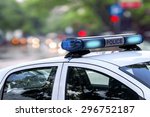 Police officer emergency service car driving street with siren light blinking 