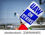 Small photo of WENTZVILLE, MISSOURI - September 30, 2023: Members of the United Auto Workers (UAW) Local 2250 picket outside of the General Motors (GM) Auto Assembly Plant as part of nation-wide labor strikes.