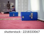 Small photo of bogor, Indonesia - October 25th 2022: Charity box placed on the side, deliberately prepared if there are mosque visitors who set aside their fortune