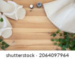 Small photo of bathhouse, traditional sauna accessories: birch broom, felt hat, felt slippers. Traditional Russian bathhouse. SPA Concept. Relax country village bath concept. free copy space