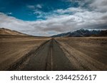 Small photo of Among the cold desert's desolation, a broken road stands as a reminder of nature's resilience against the harsh weather conditions that shape Ladakh's stark beauty.