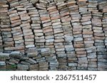 Small photo of brick by brick he built Rome, sediments that constrain history. experience that speaks with its energy. a colorful wall of life that knows everyone's experience. Color wall, stone wall.
