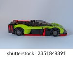 Small photo of Doha, Qatar - August 24, 2023: LEGO Speed Champions Aston Martin Valkyrie AMR Pro car isolated on white background.