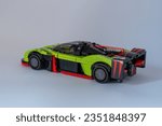 Small photo of Doha, Qatar - August 24, 2023: LEGO Speed Champions Aston Martin Valkyrie AMR Pro car isolated on white background.