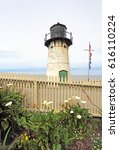 Small photo of Point Montara Fog Signal and Light Station off of California Highway 1 with picket fence and calla lilies vertical