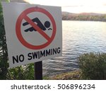 No Swimming Sign Posted On A...