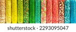 Small photo of Transparent plastic tubes full of colorful candies. Rainbow jelly