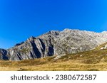 Mountain panorama in the Swiss Alps at mountain pass Gotthard on a sunny late summer day. Photo taken September 10th, 2023, Gotthard, Switzerland.