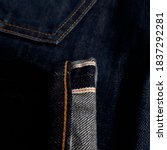 Small photo of A selvage or selvedge is a self-finished edge of a piece of fabric which keeps it from unraveling and fraying. Selvedge colour orange.