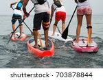Stand up paddle group on the sea