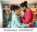 Portrait of a lovely young couple together, bonding hugging and relaxing at home