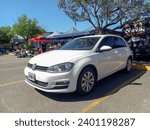 Small photo of Buenos Aires, Argentina - Dec 10, 2023: Modern white 2012 Volkswagen Golf Mk7 at a classic car show in a parking lot. Sunny day.