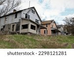 Small photo of Rows of abandoned houses in an old abandoned mining town.