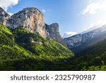 Small photo of Mountain landscape with green forest and a sunset cloudy sky. Souloise Defile, French Alps.
