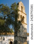 Small photo of The stone belltower of agios constantinos in an olive tree grove, paxos, ionian islands, greek islands, greece, europe