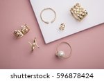 Pearl Golden Bracelets and ring on pink background - Pearl Bracelets on paper background setup 