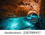 Small photo of Underground Lake.. Cave of Tapolca, Hungary near Balaton lake. System of underground caves situated in the heart of the city. Boat trip
