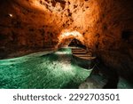 Small photo of Underground Lake.. Cave of Tapolca, Hungary near Balaton lake. System of underground caves situated in the heart of the city. Boat trip