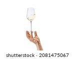 Degustating delicious wine. Cropped image of male hand holding glass with white wine isolated over white background. Concept of alcohol, drink, party, degustation, holiday. Copy space for ad