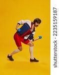 Small photo of Portrait of stylish man with moustache in vintage sportswear training with dumbbells isolated on yellow background. Strong hands. Concept of retro style, creativity, emotions, facial expression, sport