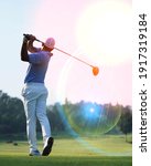 Small photo of Golfers are playing golf at field selective focus background
