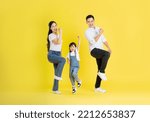 happy asian family image, isolated on yellow background
