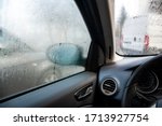 Steamy car window on a autumn rainy/foggy day. Concept of safety driving problem