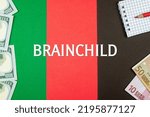 Small photo of BRAINCHILD - word (text) and money dollars and euros on a table made of different colors, a notepad and a red pencil. Business concept, buy, sell, exchange (copy space).