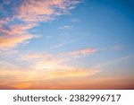Small photo of Beautiful of luxury soft gradient orange gold clouds and sunlight on the blue sky perfect for the background, take in everning,Twilight