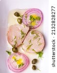 Small photo of Turkish appetizer Pickled Tunny Fish with Olive Oil (Turkish name; Lakerda)