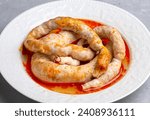 Small photo of Traditional delicious Turkish cuisine, Middle Eastern dishes, offal dishes, stuffed sheep intestines (Turkish name; Mumbar dolmasi)