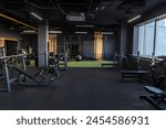 Dark gym interior with sports...