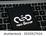 Small photo of NSO Group logo seen on the smartphone placed on Apple Macbook laptop keyboard. Israeli company known for its Pegasus spyware for survaliance. Stafford, United Kingdom, July 19, 2021.