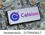 Small photo of Celsius crypto company logo seen on smartphone placed on the dollar banknotes. Stafford, United Kingdom, July 19, 2022